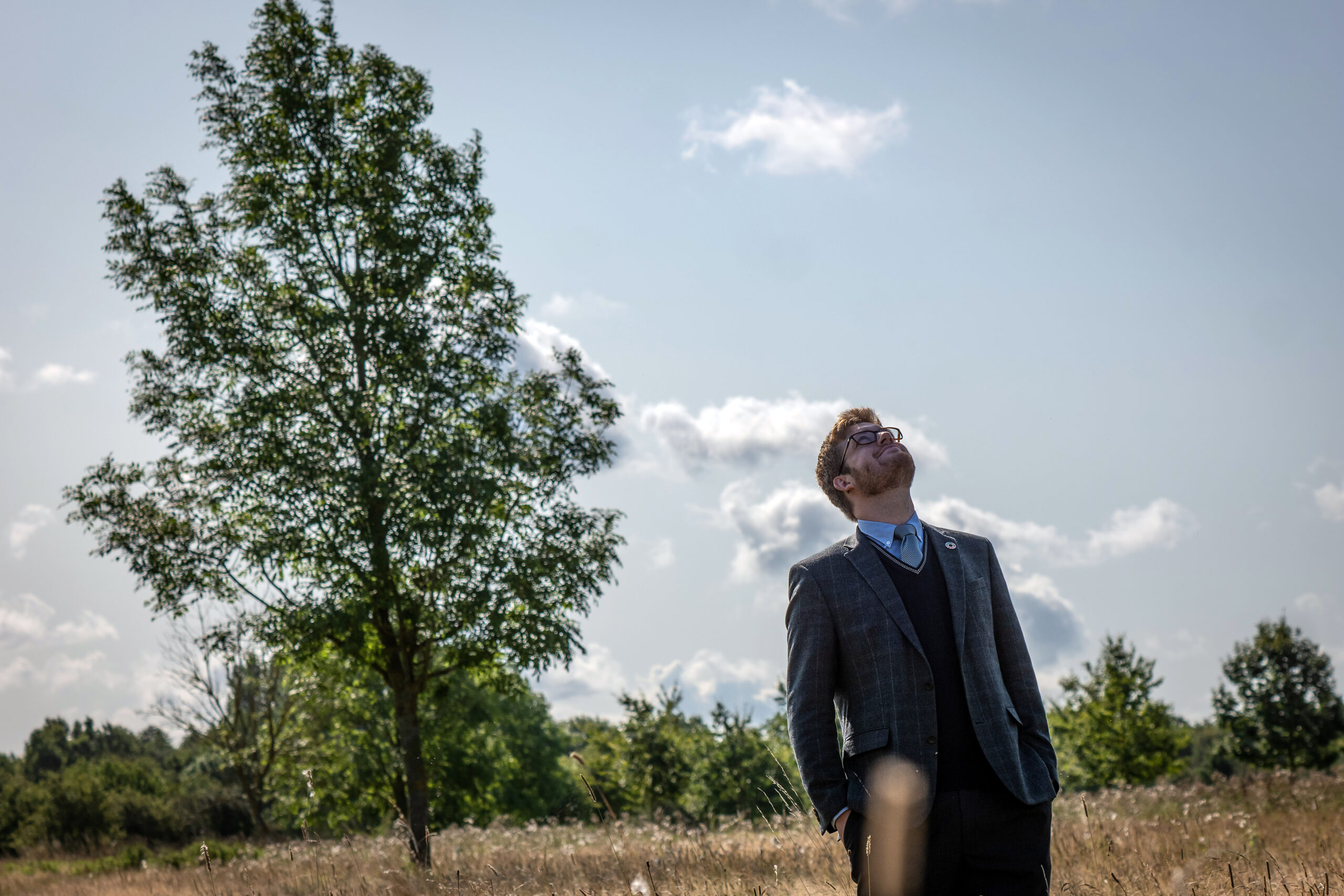 Simon Vilms Pedersen in field looking towards the sky